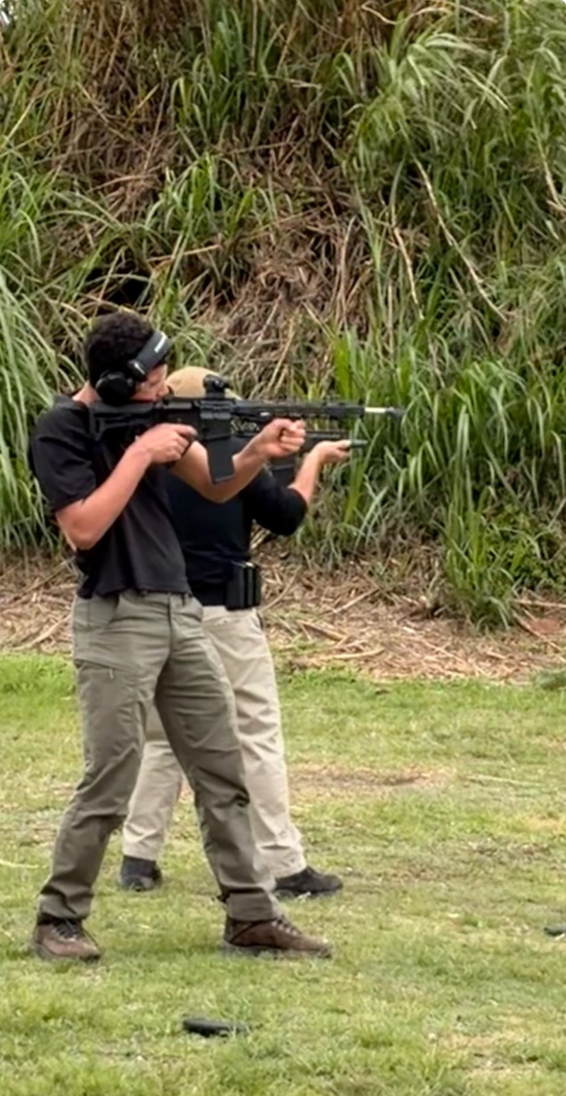 Frank coaching a student on rifle fundamentals